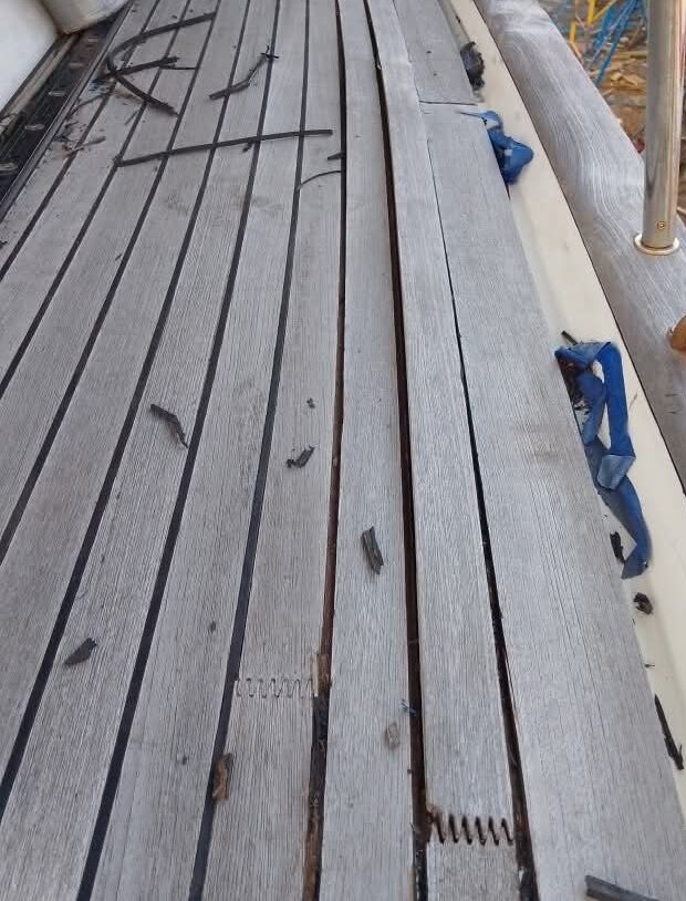 Weathered genuine teak deck before restoration