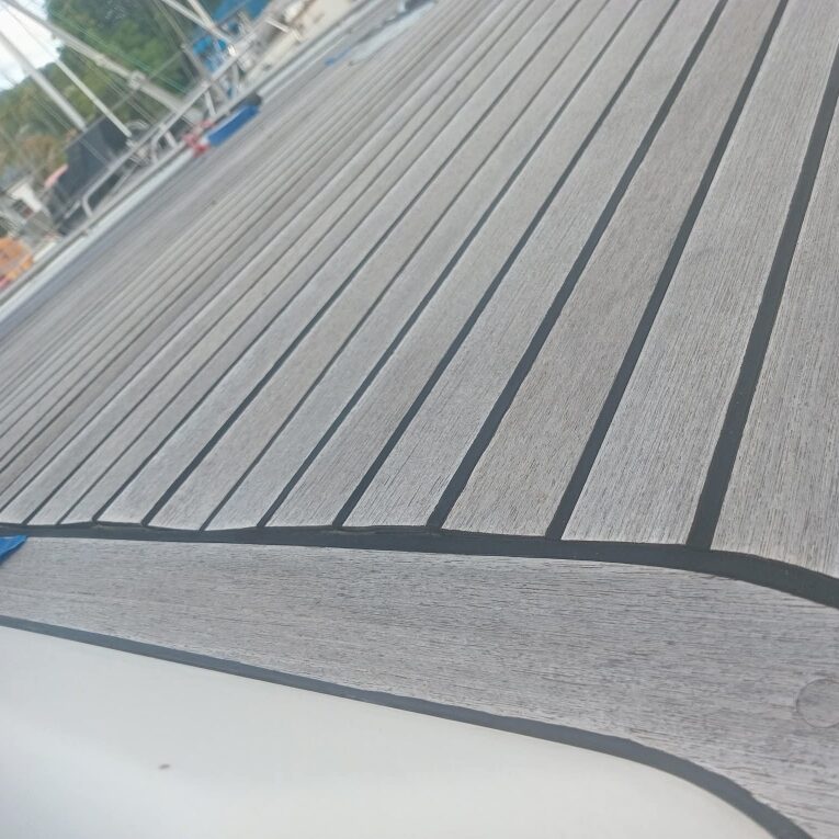 Weathered genuine teak deck detail before restoration