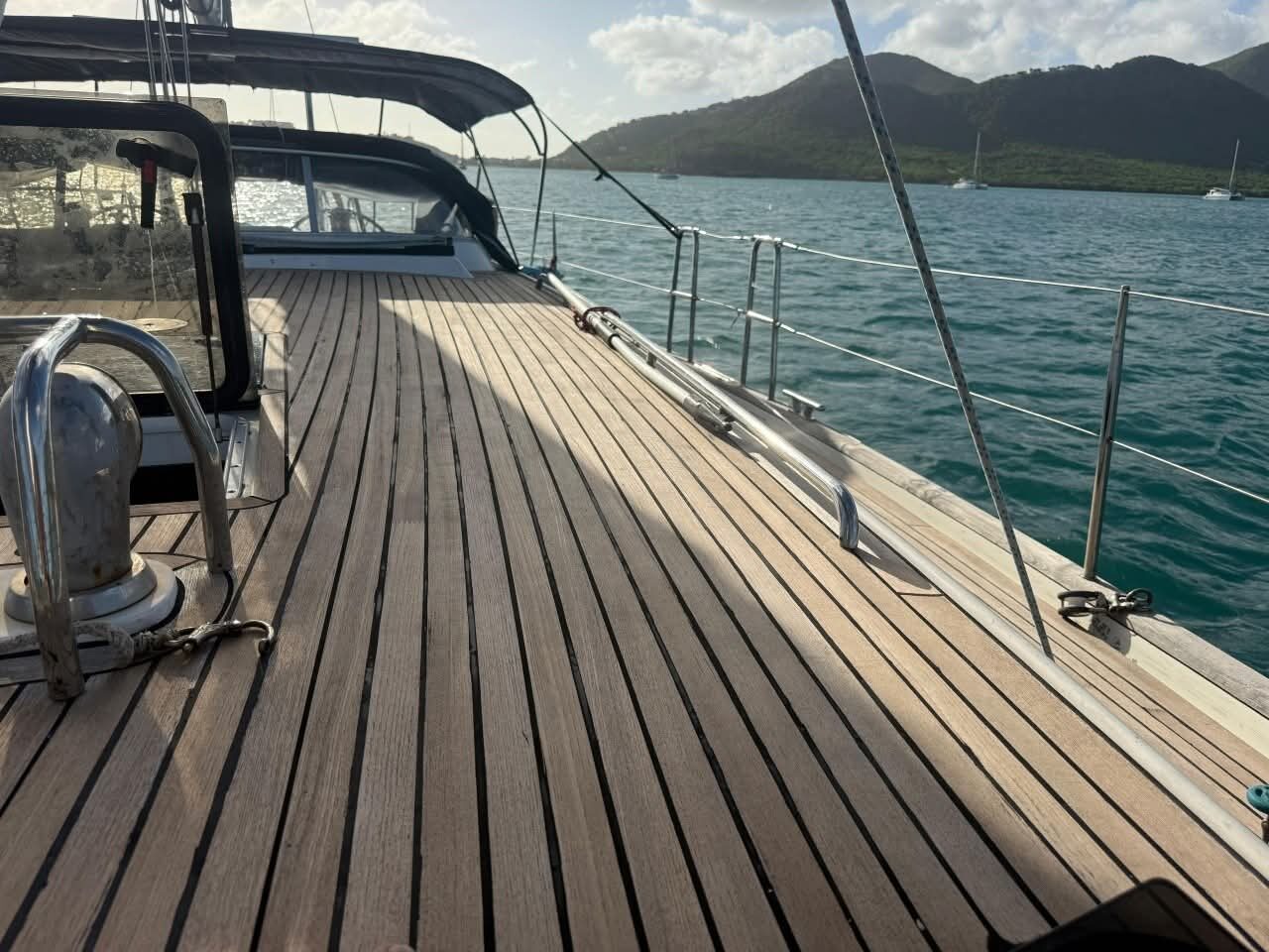Restored genuine teak side deck with fresh black caulking